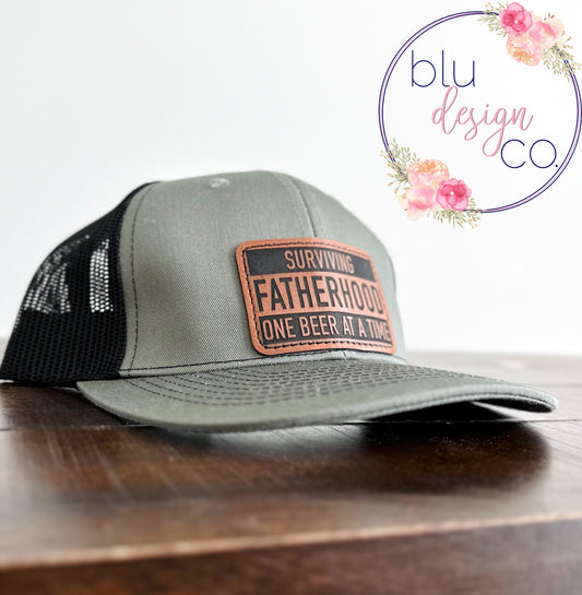 Surviving Fatherhood One Beer At A Time Adult Hat